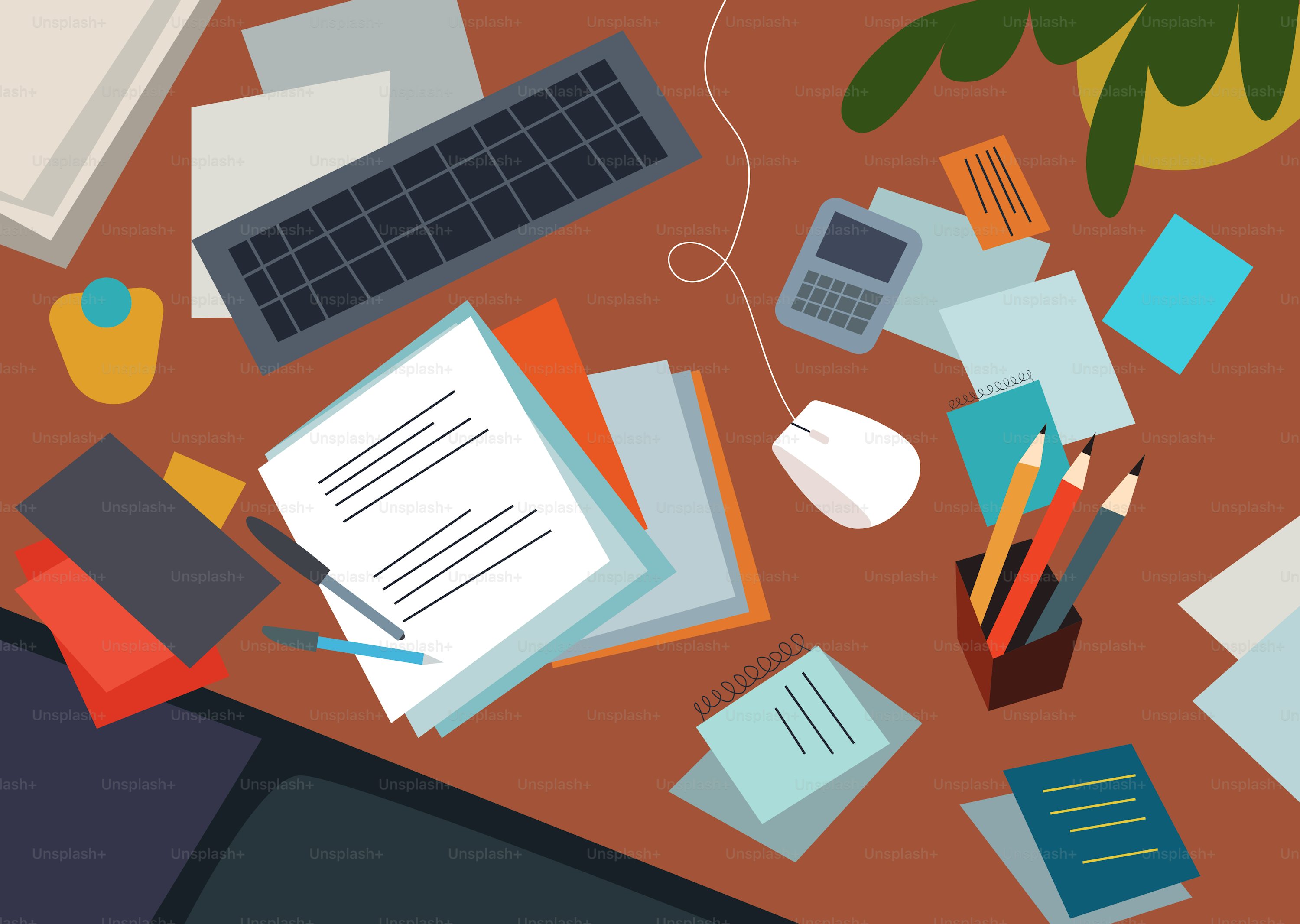 An untidy desk indicating a busy person has been working lots.